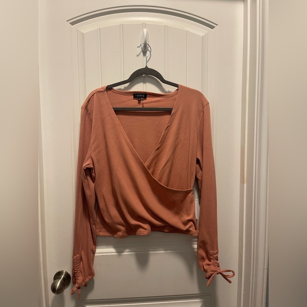 1. State
Womens size XL
NWT
Women's pink Wrap Top